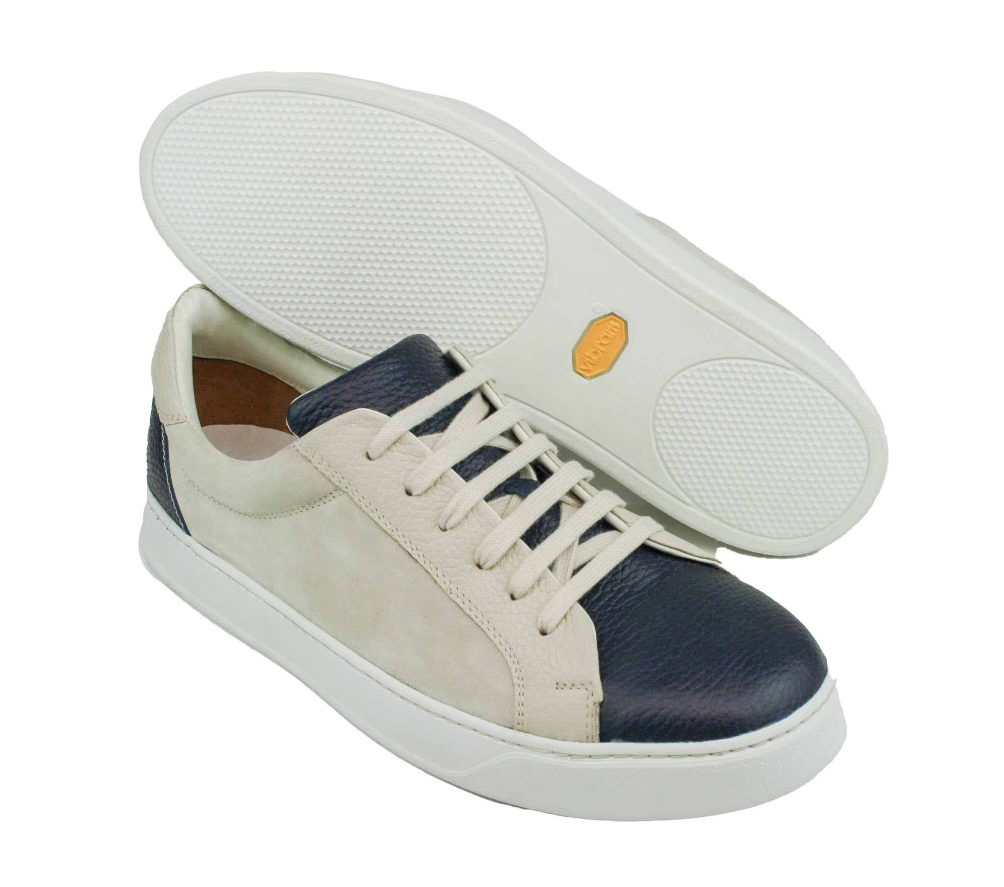 Exclusive dark blue–beige sneaker, combined with suede leather and white sole
