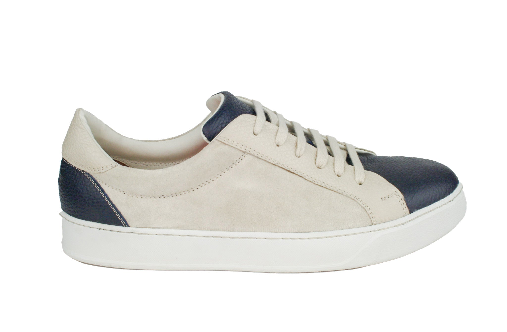 Exclusive dark blue–beige sneaker, combined with suede leather and white sole
