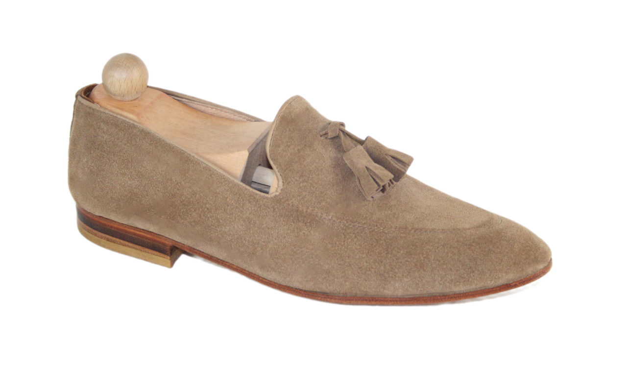 Classic light brown suede Tassel loafer model.